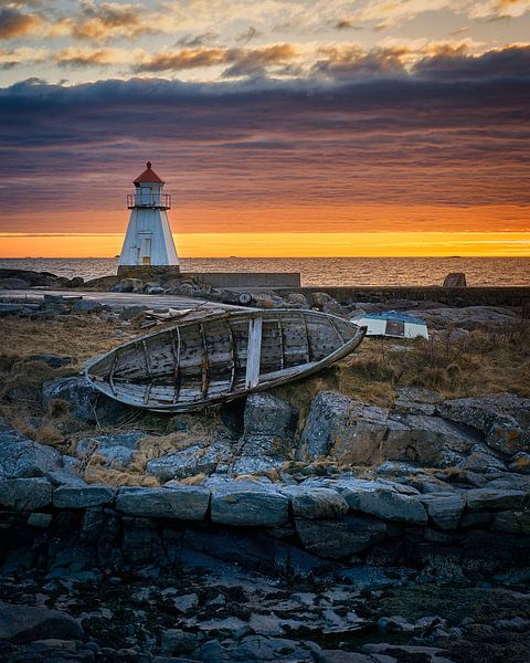 Sunset at lighthouse with old boat on Vigra, Ålesund, Norway by qtx