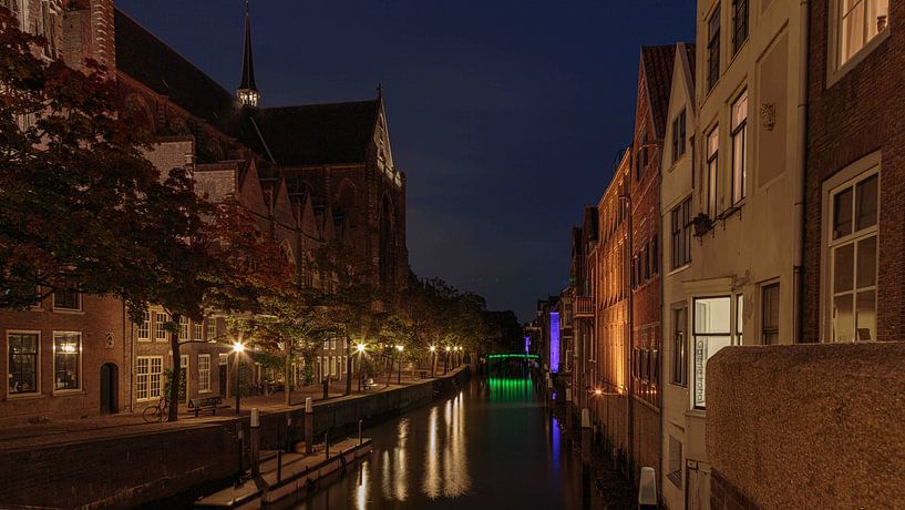 Atmospherically lit canal in Dordrecht by Roel Jonker