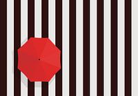Pedestrian crossing with red umbrella.