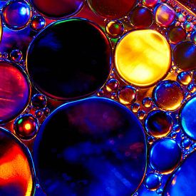 Oil drops on water by Harry Wedzinga
