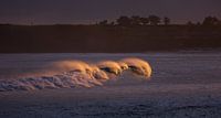 Golden waves in an early sunrise in Bali