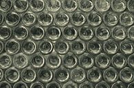 Wall full of bottle bottoms by Melissa Peltenburg thumbnail