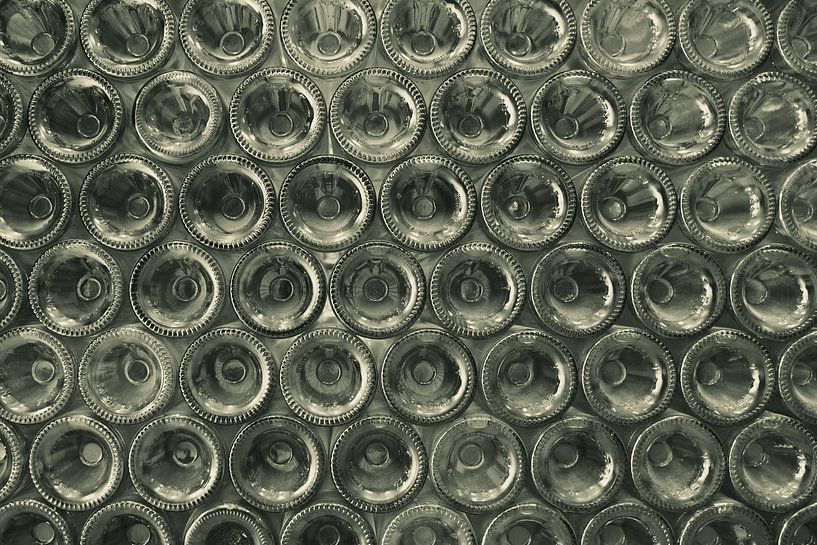 Wall full of bottle bottoms by Melissa Peltenburg