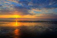 zonsondergang aan zee