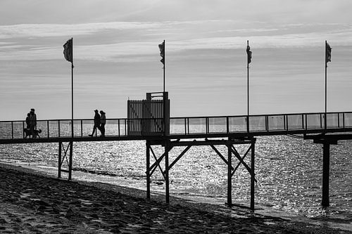 Walking on the wooden bridge over the sea
