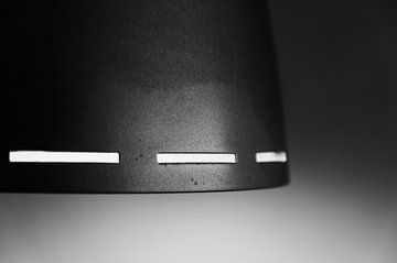 White lines on a dark grey object