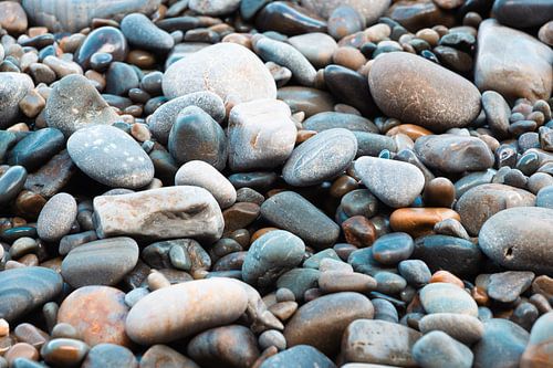 Blue/grey pebbles by the sea by Truus Nijland
