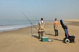 Fishermen on the beach by Pim van der Horst