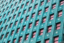 Brick Building with Pink Windows by Tom Windeknecht