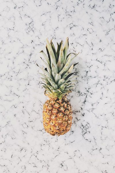 Pineapple on white marble by MADK