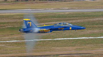High speed pass of Blue Angels #7 during airshow. by Jaap van den Berg