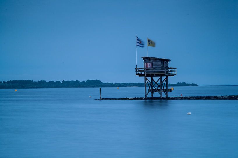 flags by house on waterside van jan koelewijn fotografie