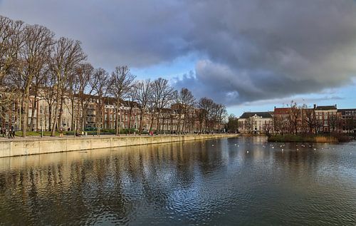 Hofvijver pond, trees and historical buildings at the Dutch Parliament Binnenhof in The Hague, The N by Jan Kranendonk