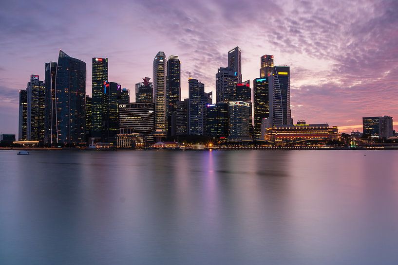 Singapore skyline after sunset by Ilya Korzelius