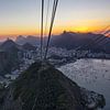 The city of Rio de Janeiro, the cable car station at the top of the Sugar Loaf hill with behind it t by Tjeerd Kruse