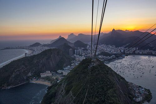 The city of Rio de Janeiro, the cable car station at the top of the Sugar Loaf hill with behind it t