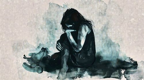 Melancholische vrouw omhelst haar knieën