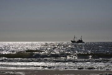 North Sea beach with fishing boat. by Wim Jacobs