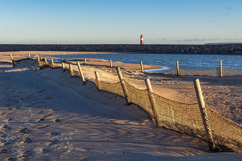 Beach and pier on the coast of the Baltic Sea in Warnemünde by Rico Ködder