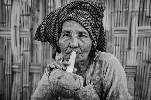 BAGHAN, MYANMAR, 12 DECEMBER 2015 - Cheroot smoking old woman in Baghan. Cheroot is a traditional ci