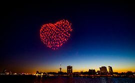 Skyline by night - Doneshow a big heart over downtown Rotterdam during sunset by Frank de Roo