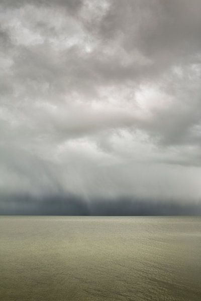 Groene kalme zee onder een hagel bui by Marjon Meinders