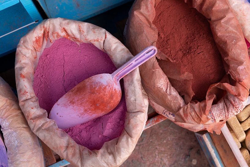 bags of paint pigment in different colours for sale at a Moroccan street market. Chefchaouen by Tjeerd Kruse