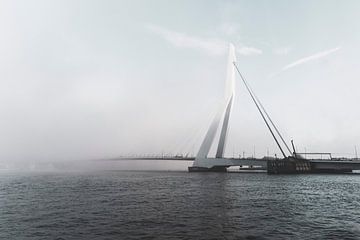 Erasmus Bridge disappears in the fog. by Teun de Leede