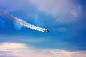 Jetfighter with smoke trail.