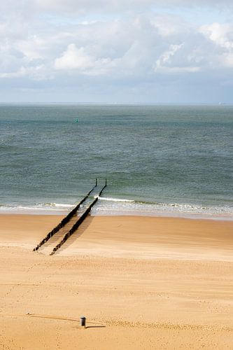 A deserted beach at Zoutelande with a row of breakwaters