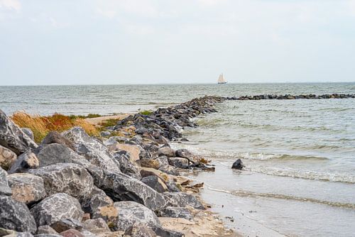 Breakwater with sailboat