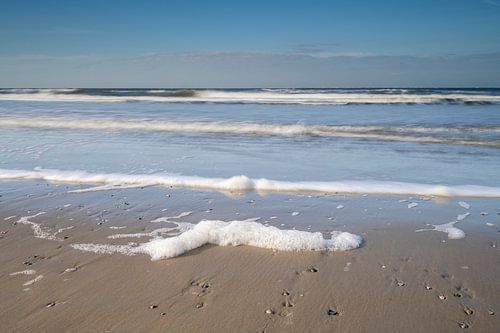 Foam on the beach by Richard Gilissen