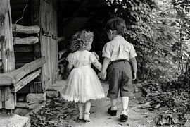 children walk together through nature