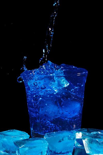 Blue curacau cocktail in a glass by Eye on You