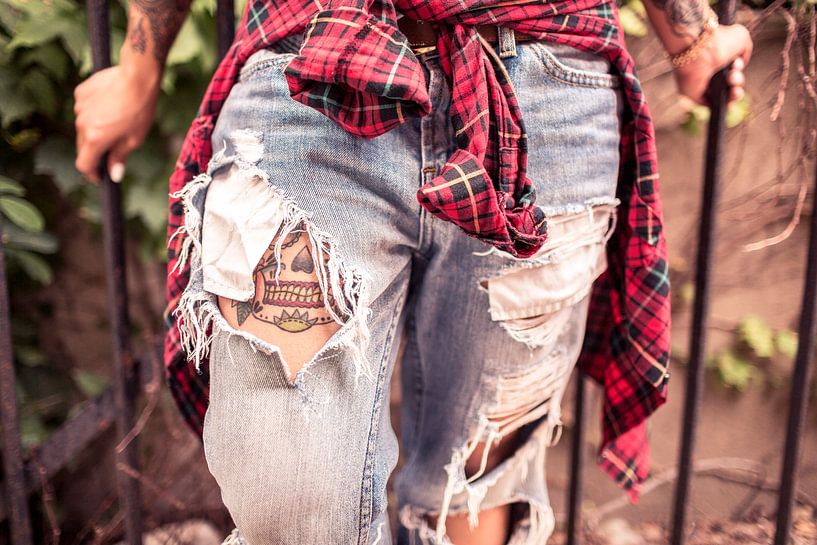 Woman with tattoo walks up the stairs by Atelier Liesjes