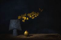 Zen still life with autumn branch and pear .