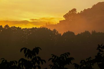 Shortly after sunset you can see the fortress Königstein in the background in the golden clouds by Claudia Schwabe