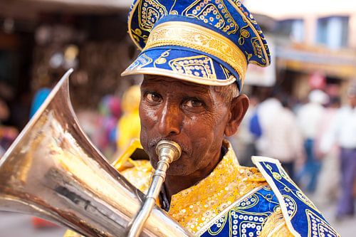 Indian trumpeter in Hindustani festive procession during the Kumbh Mehla in Haridwar India. Wo
