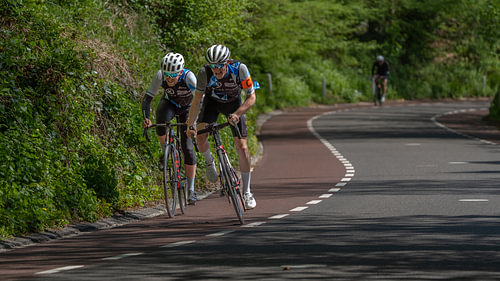 Pure Grit: Elite Road Cyclists Fighting the Steep Uphill Ascent