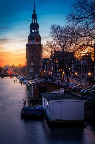 The Montelbaanstoren in Amsterdam during the sunset standing
