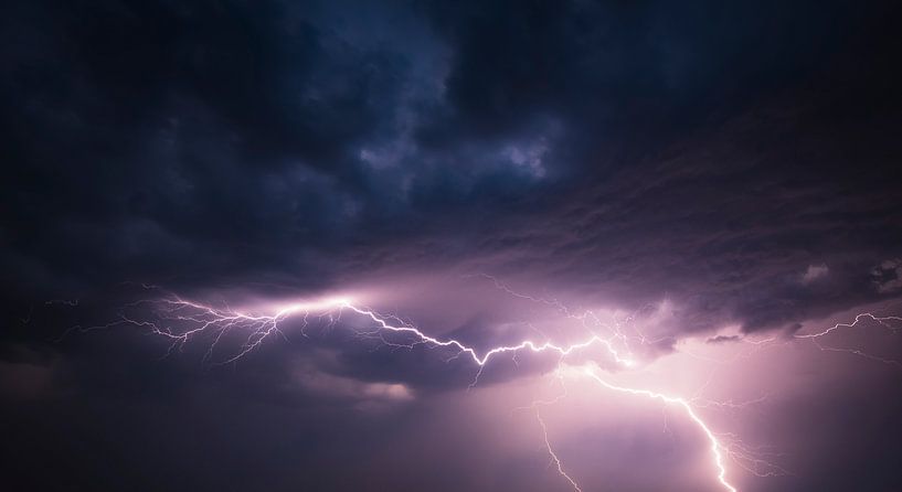 Lightning in the dark night sky during a summer thunderstorm by Sjoerd van der Wal Photography