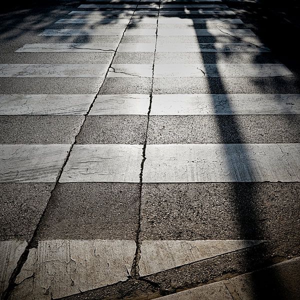 Zebra crossing on a street in the historic port city of Porec in Croatia by Heiko Kueverling