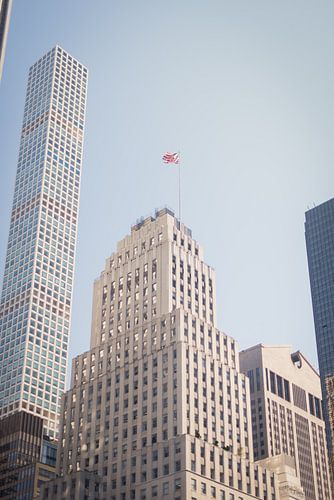 Stars and Stripes and a skyscraper in the background