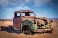 A car wreck in the desert.