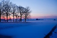 Winter landscape with sunset