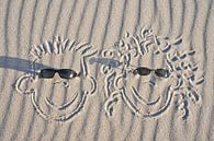 faces drawn in the sand on the beach of the Baltic Sea by Martin Köbsch thumbnail