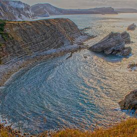 Lever de soleil à Mupe Bay avec les falaises sur Jos van den Berg