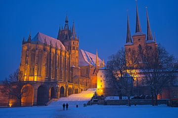 Cathedral Square in Erfurt with the cathedral and Severi Church in the snow in winter during the blue hour