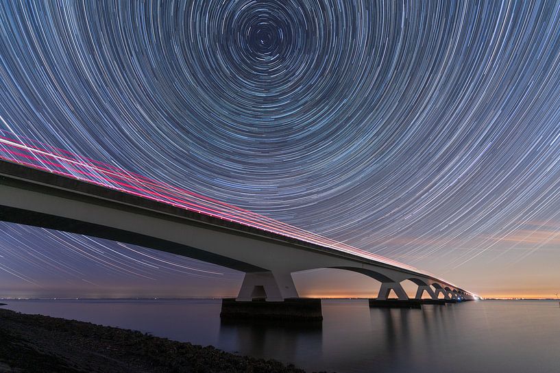The Zeeland Bridge on a clear night by Roy Poots