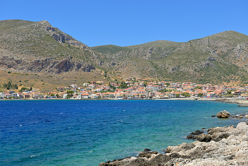 The Greek coastal village of Monemvasia, situated on a blue bay of the Aegean Sea